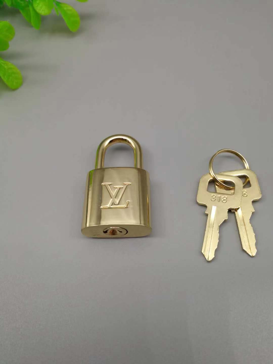 LV Gold Lock & Key Accessory